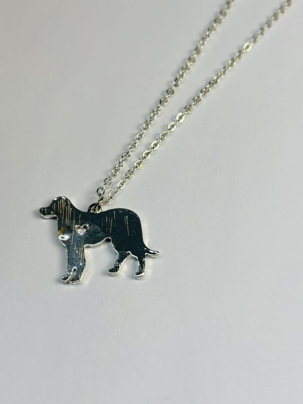 微信图片_20251112200447_208_64 Silver-Toned Dog Silhouette Pendant Necklace with Heart Detail - Image 1